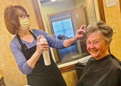 resident at the salon smiling